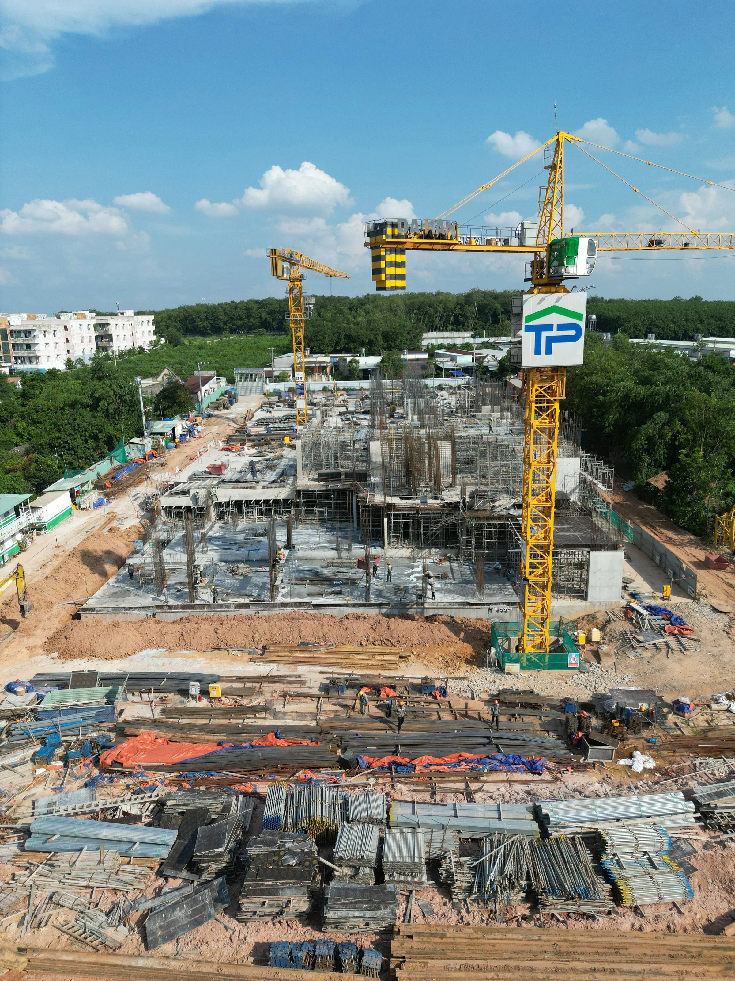 Conceptual construction photography of a crane and concrete structure